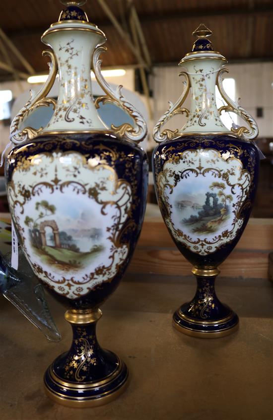 A pair of large Coalport oviform pedestal vases and covers, 36cm